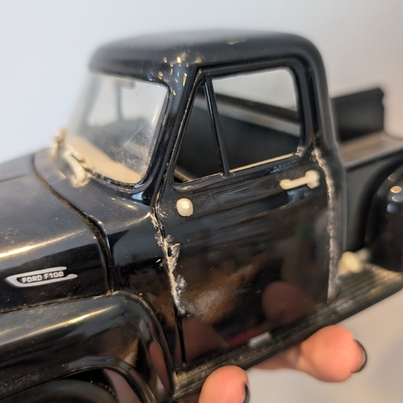 Classic Black Toy Truck with Red Wheels - Picture 5 of 11